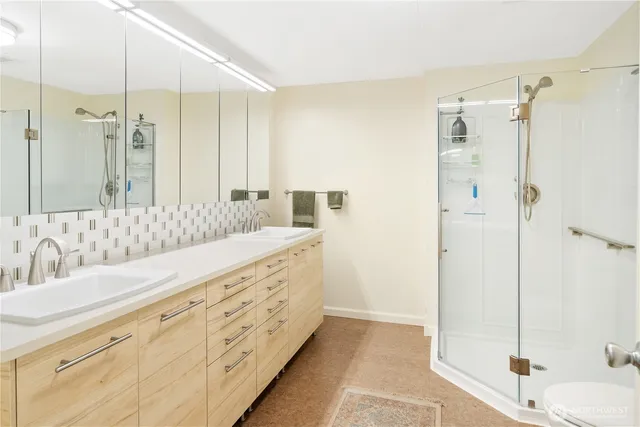 a view of a kitchen with a sink washer and dryer