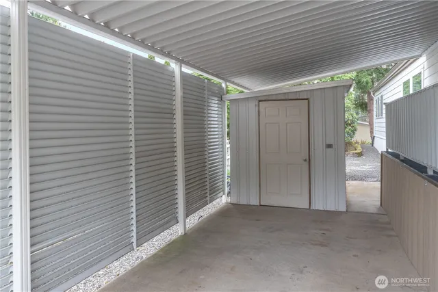 a view of a house with swimming pool and sitting area