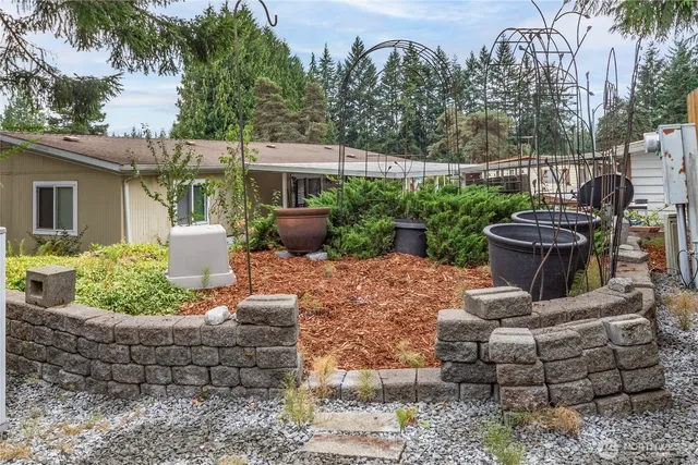 a view of a garden with an outdoor space
