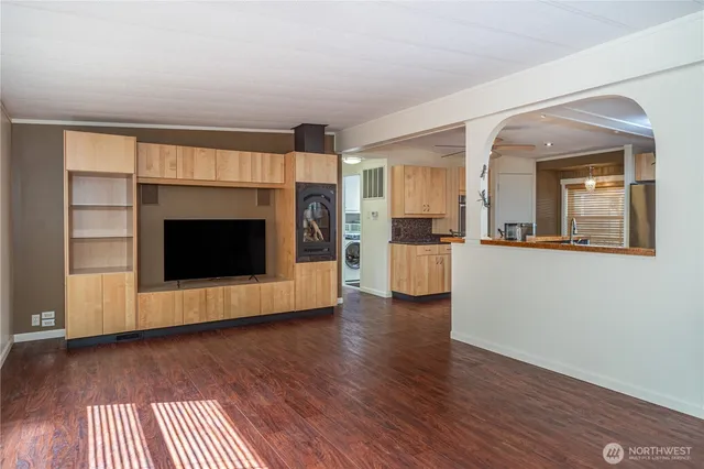 a kitchen with granite countertop a sink and a refrigerator