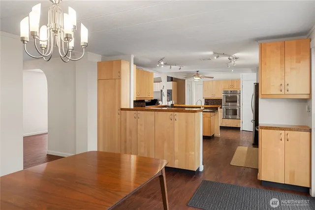a view of a room with wooden floor and chair