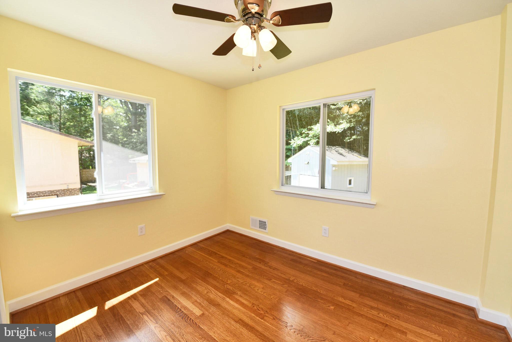 13516 Collingwood Terrace Silver Spring, MD 20904 - Photo 15 of 29 a view of empty room with wooden floor and fan