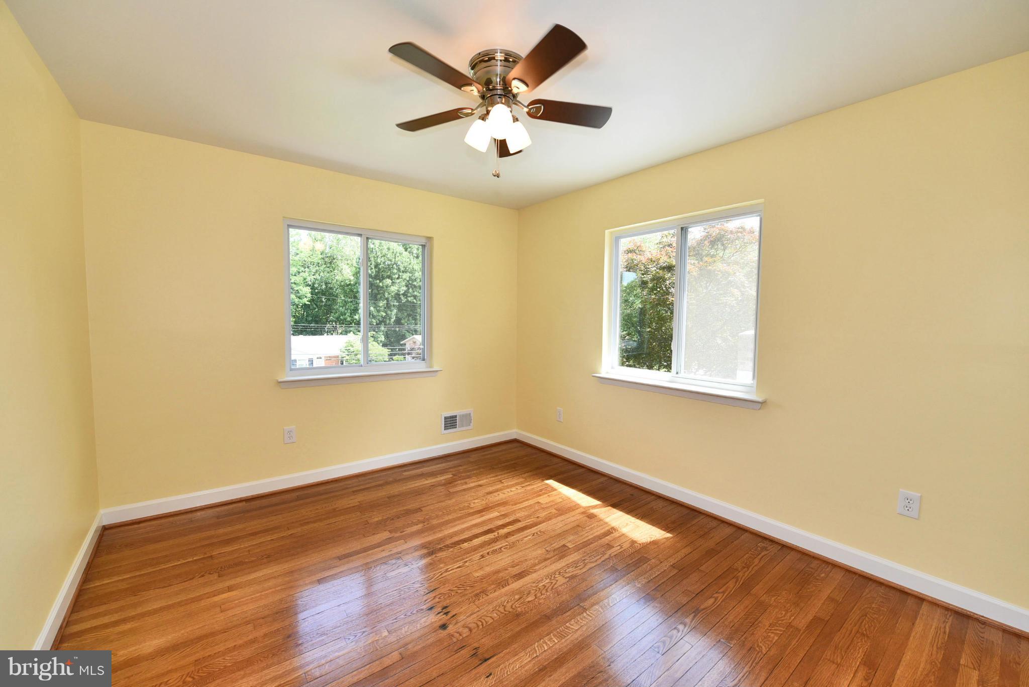 13516 Collingwood Terrace Silver Spring, MD 20904 - Photo 17 of 29 a view of an empty room with window and wooden floor