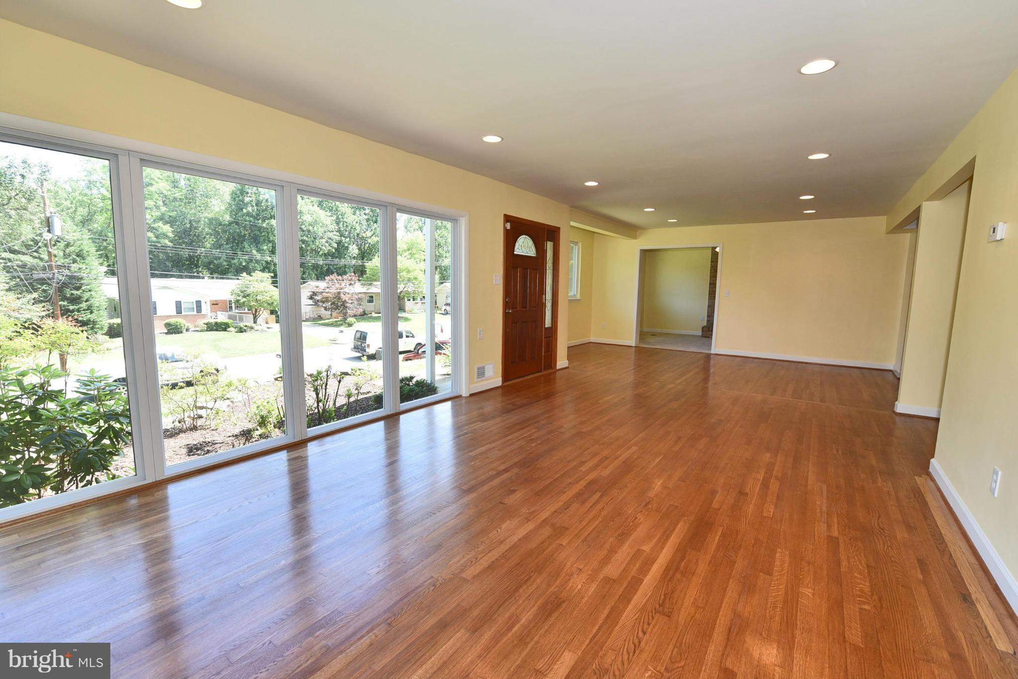 13516 Collingwood Terrace Silver Spring, MD 20904 - Photo 3 of 29 a view of an empty room with wooden floor and a window