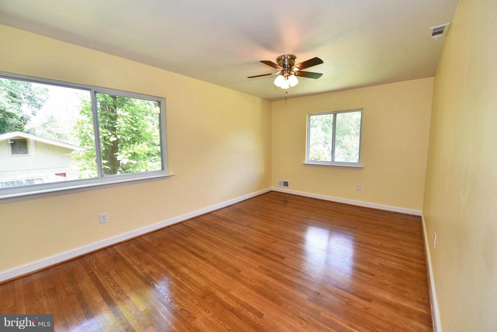 13516 Collingwood Terrace Silver Spring, MD 20904 - Photo 26 of 29 a view of empty room with wooden floor and fan