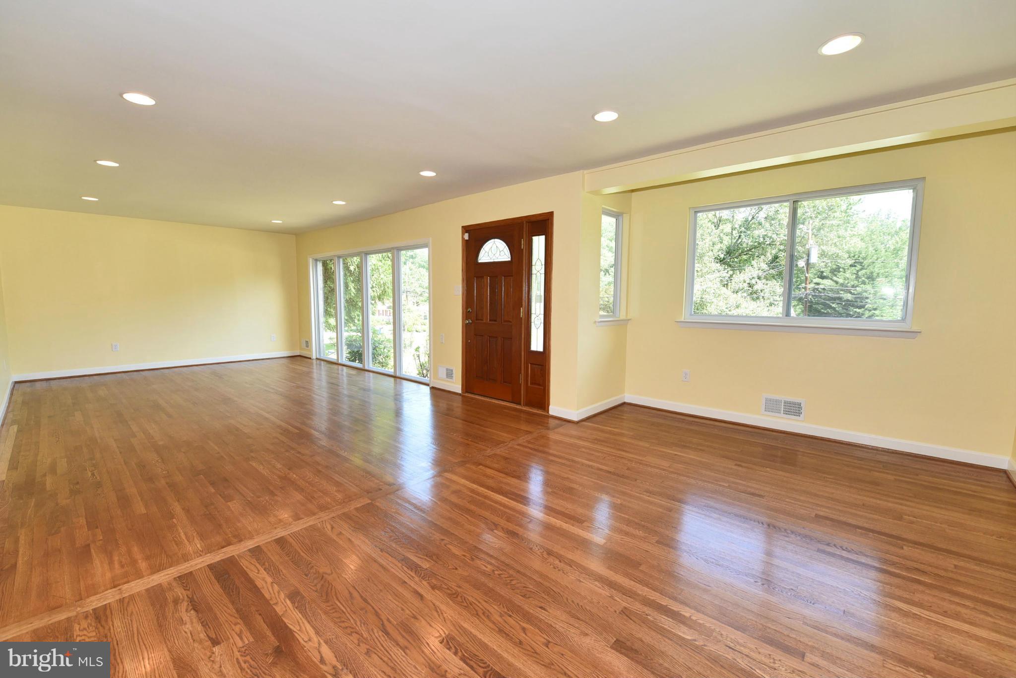 13516 Collingwood Terrace Silver Spring, MD 20904 - Photo 4 of 29 a view of an empty room with wooden floor and a window