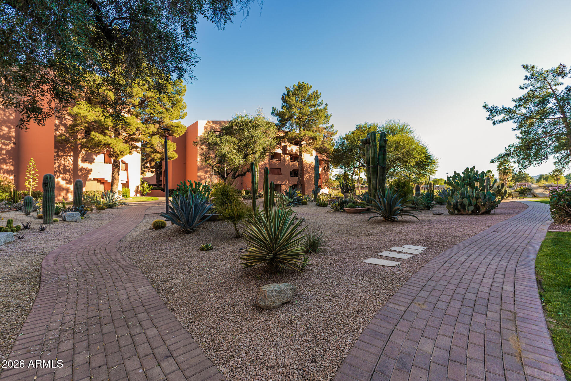 4303 East Cactus Road, Unit 126 Phoenix, AZ 85032 - Photo 29 of 31 a view of a street with some trees