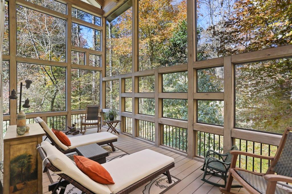 This custom screened porch is to die for!  Imagine sitting here listening to a summer rain storm... Zen...