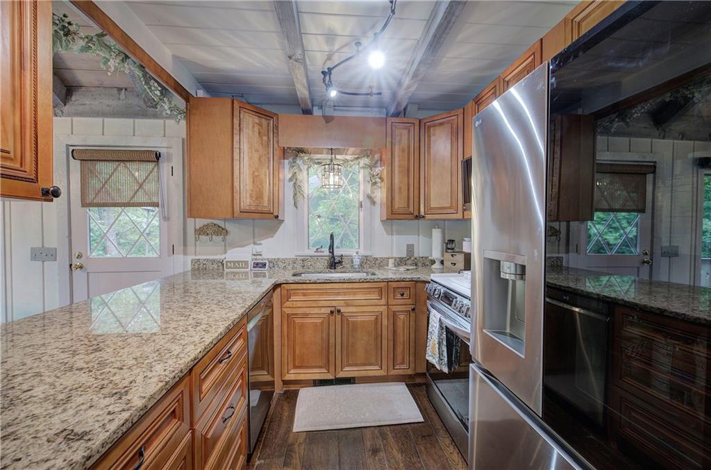 298 Lake View Trace Jasper, GA 30143 - Photo 14 of 31 a kitchen with a sink stove and microwave