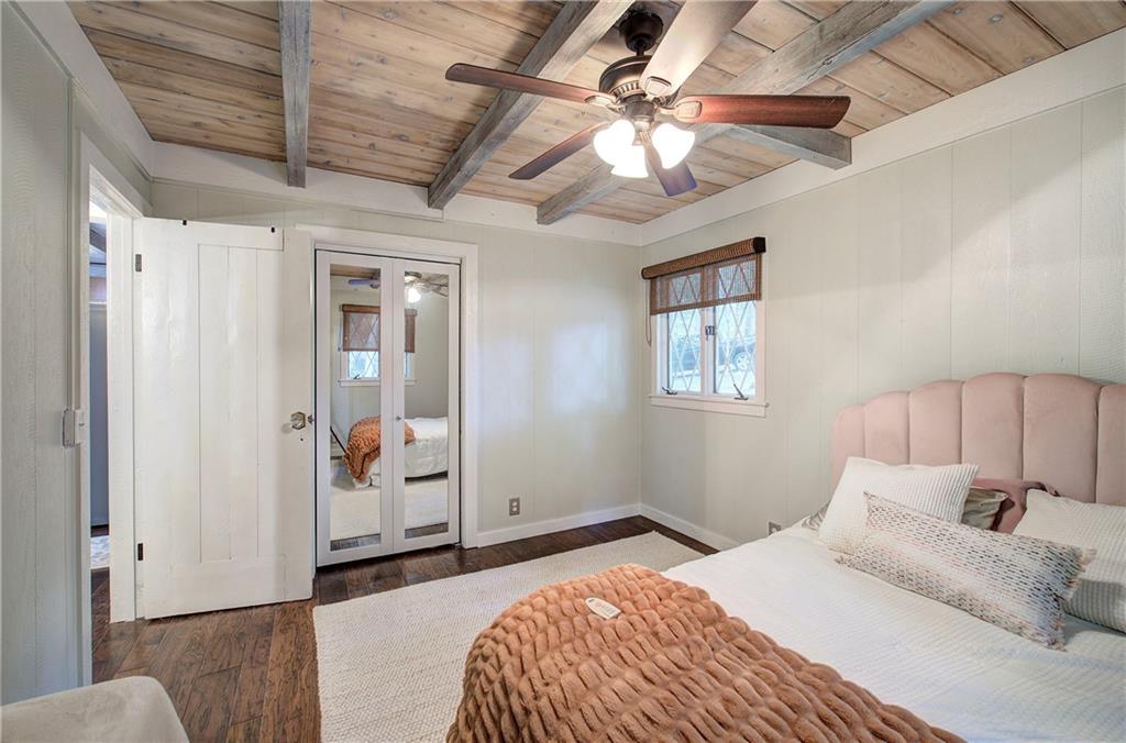 298 Lake View Trace Jasper, GA 30143 - Photo 17 of 31 a bedroom with a large bed and a chandelier