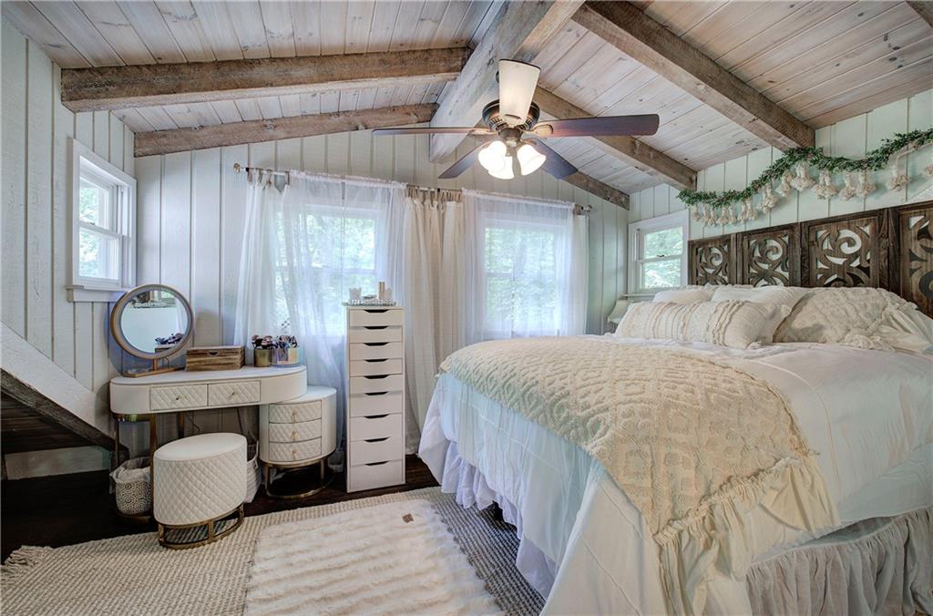 298 Lake View Trace Jasper, GA 30143 - Photo 20 of 31 a bedroom with a bed and wooden floor