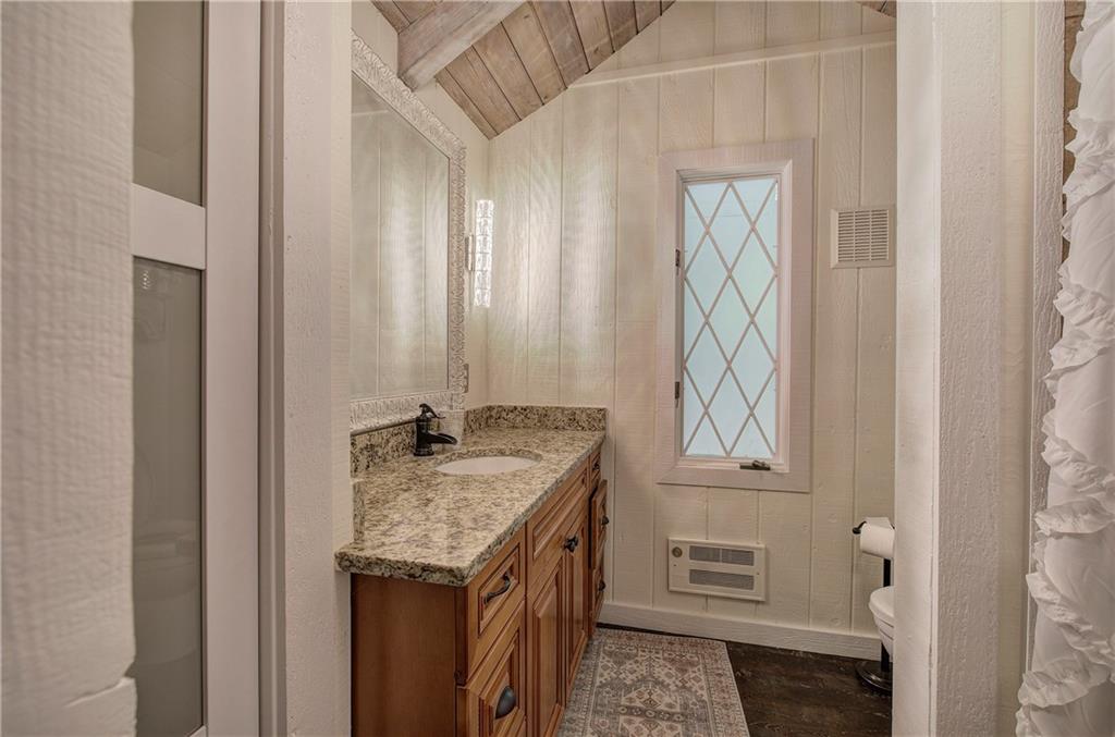 298 Lake View Trace Jasper, GA 30143 - Photo 23 of 31 a bathroom with a granite countertop sink and a mirror