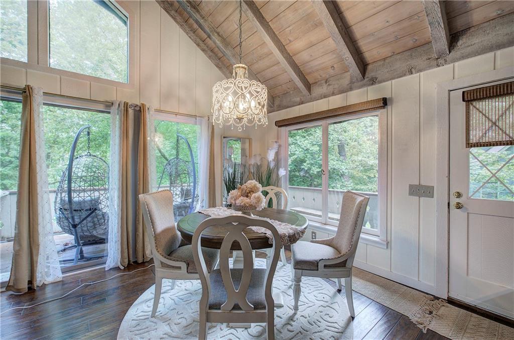 298 Lake View Trace Jasper, GA 30143 - Photo 8 of 33 a view of a dining room with furniture wooden floor and chandelier