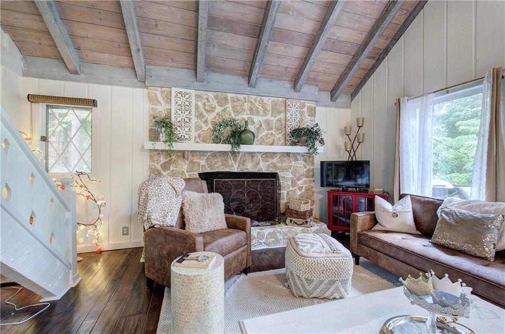 298 Lake View Trace Jasper, GA 30143 - Photo 10 of 31 a living room with furniture fireplace and a large window