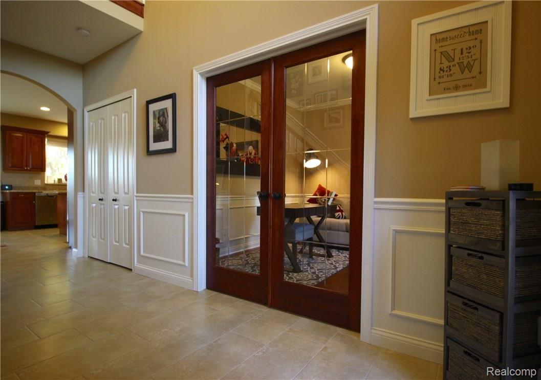 8608 East Pearson Road Utica, MI 48316 - Photo 19 of 44 Need to take an important phone call? Just close the French doors on your private office.