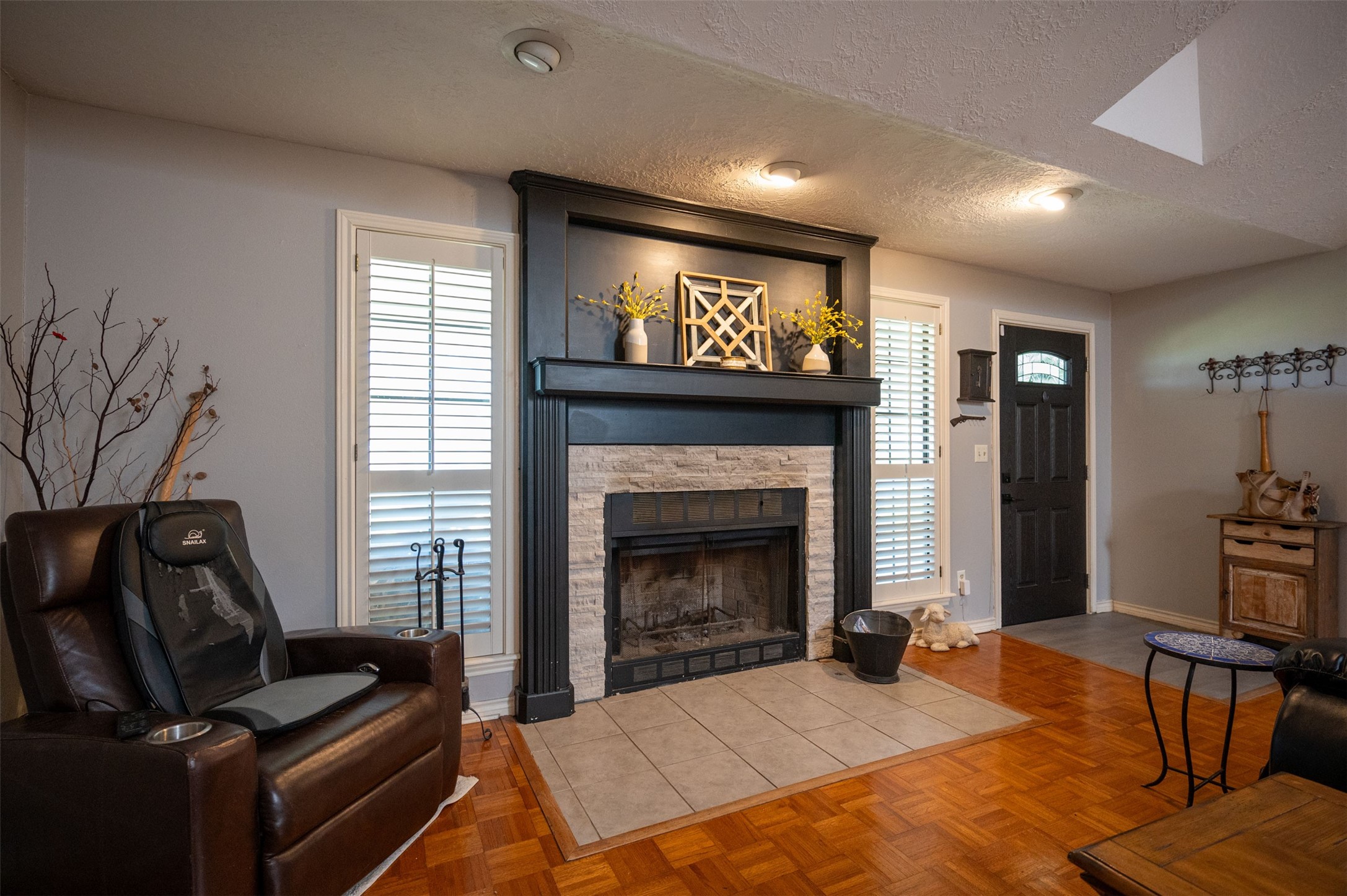 228 Camden Road Chester, TX 75936 - Photo 18 of 50 a living room with furniture a flat screen tv and a fireplace