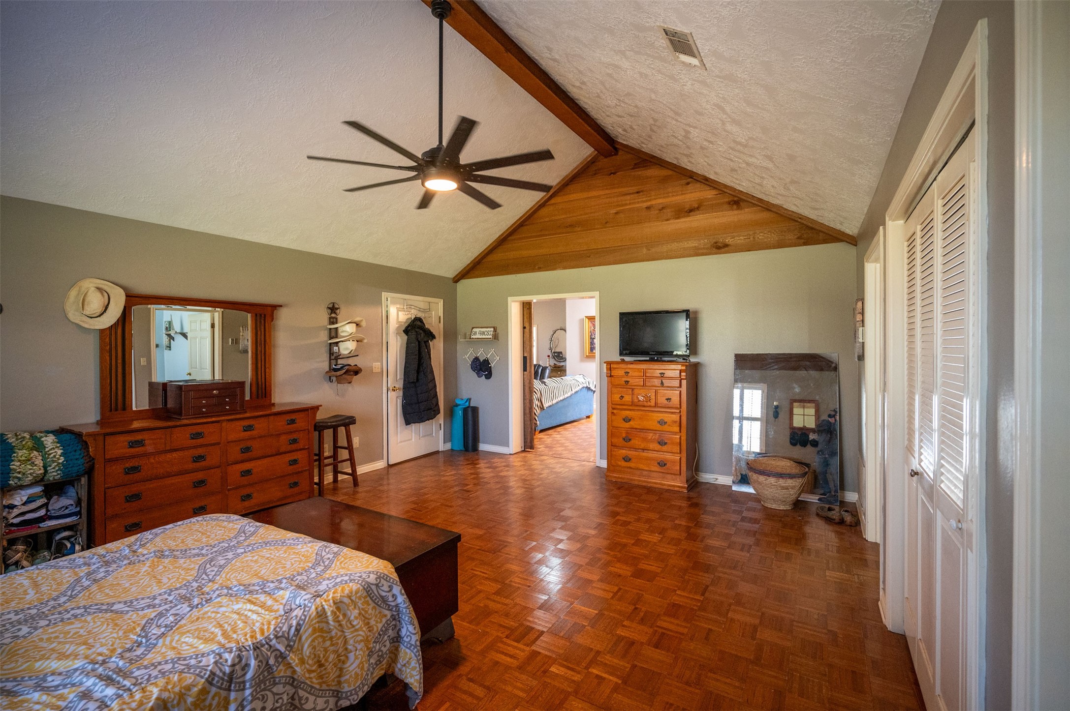 228 Camden Road Chester, TX 75936 - Photo 27 of 50 a bedroom with a bed and a chandelier