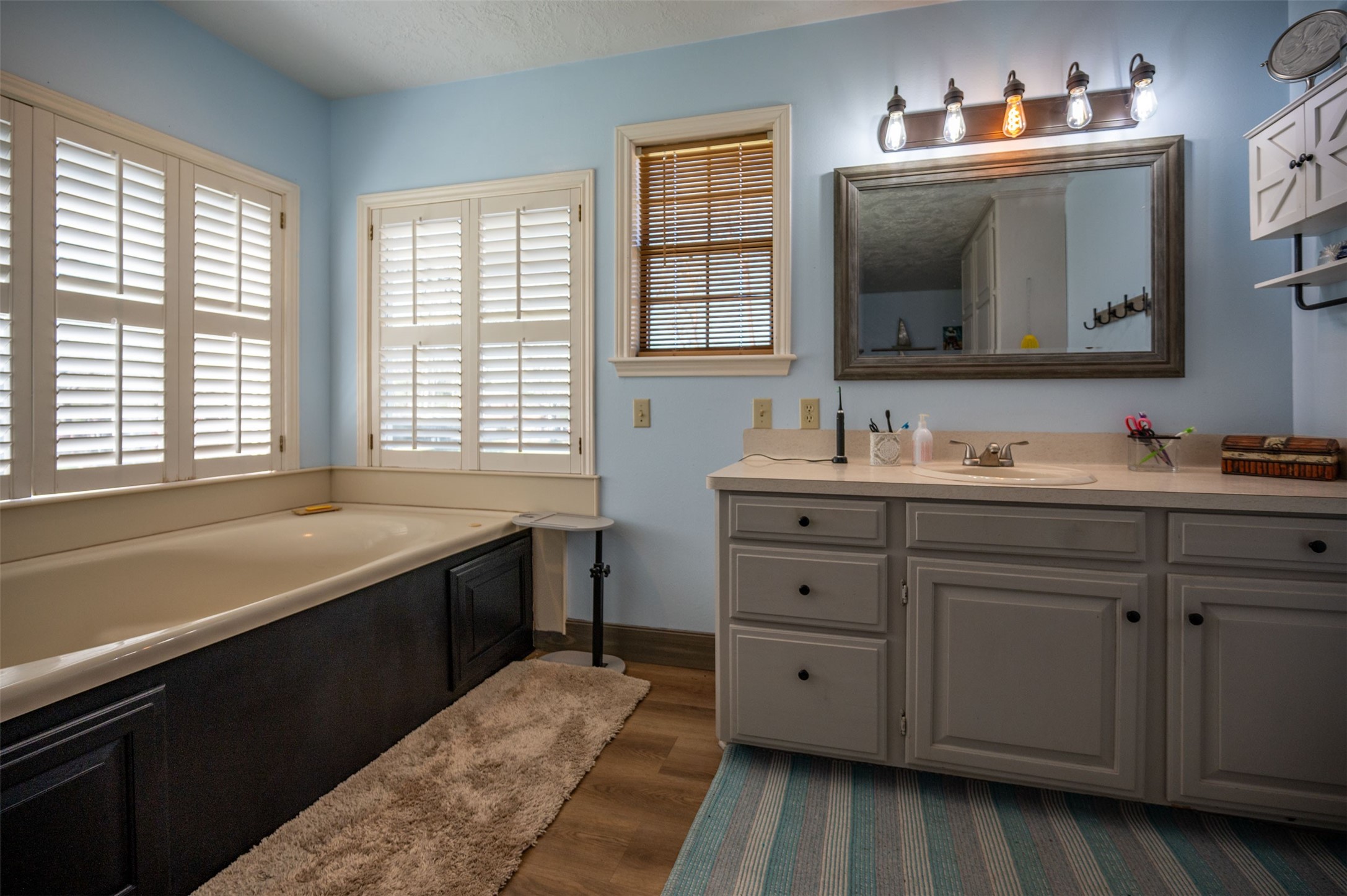 228 Camden Road Chester, TX 75936 - Photo 28 of 50 a bathroom with a double vanity sink and a mirror