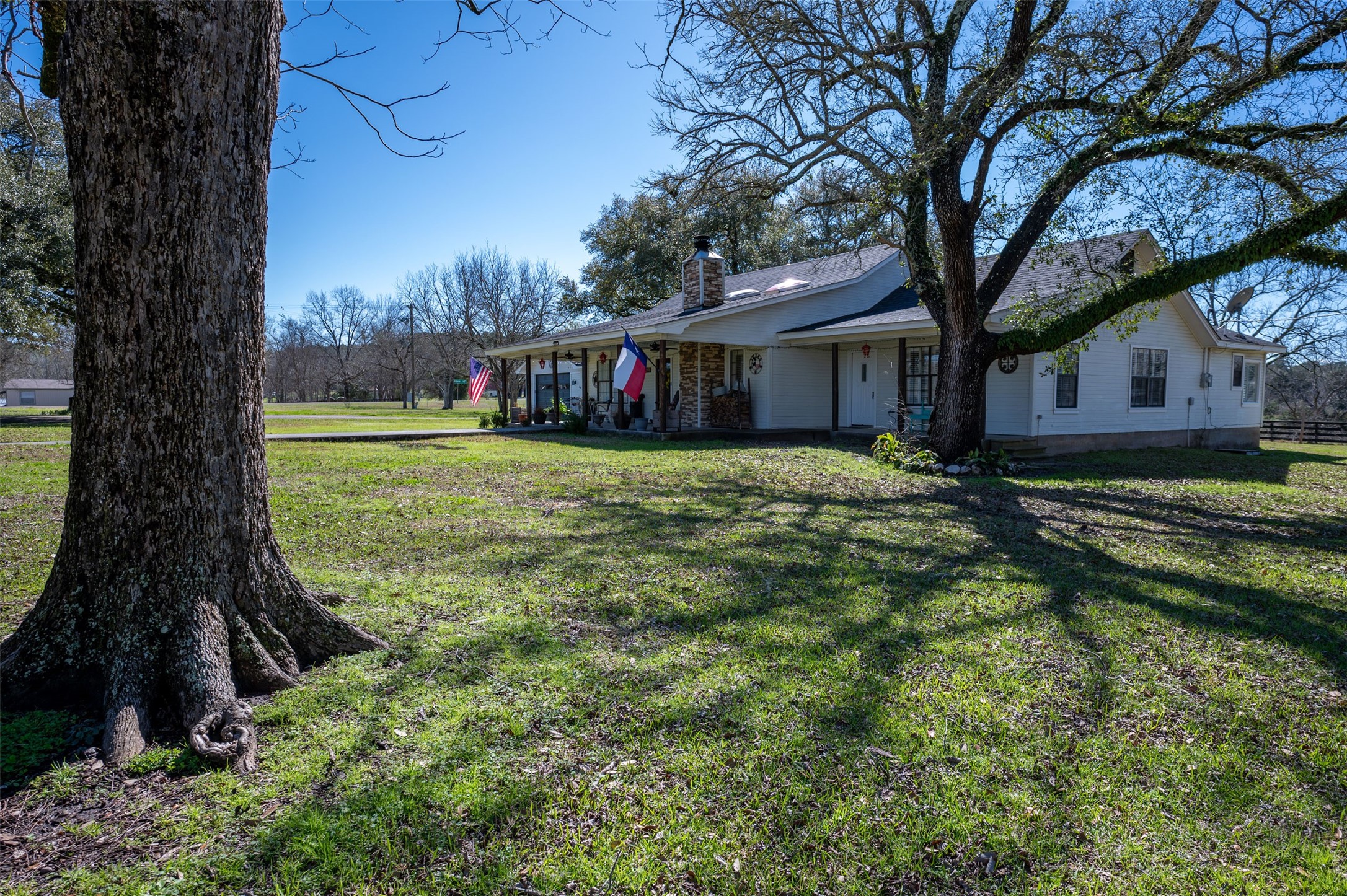 228 Camden Road Chester, TX 75936 - Photo 7 of 50 a view of a house with a tree in a yard