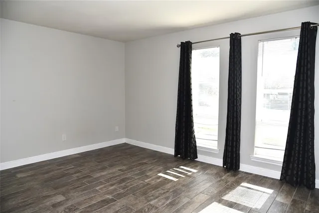 a view of a kitchen with a sink and a window