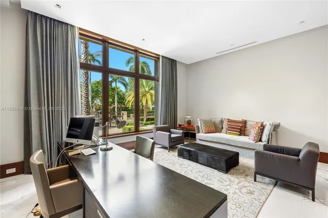 a view of a a dining room with furniture window and wooden floor