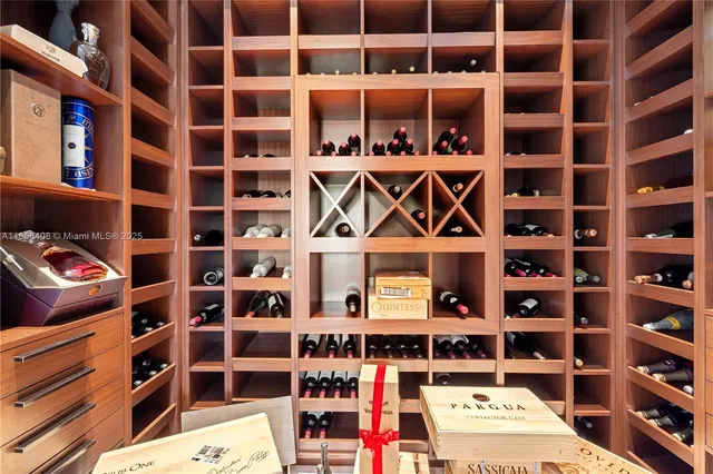 a spacious bedroom with a bed and glass windows