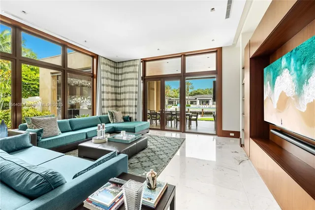 a bedroom with a bed a table and painting on the wall