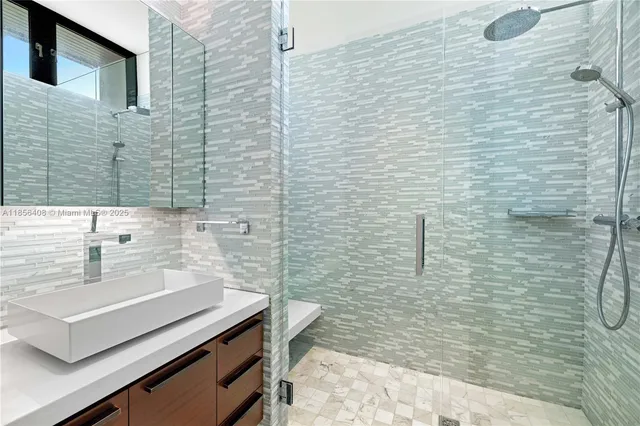 a kitchen with a sink a stove cabinets and a refrigerator