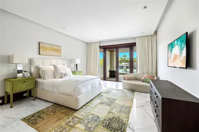 a view of a swimming pool with a lawn chairs and plants