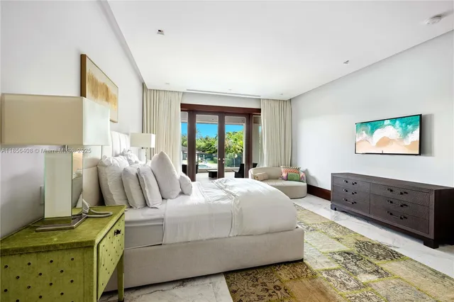 a view of a house with swimming pool and sitting area