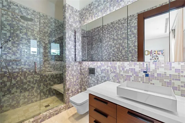 an aerial view of a houses with a lake view