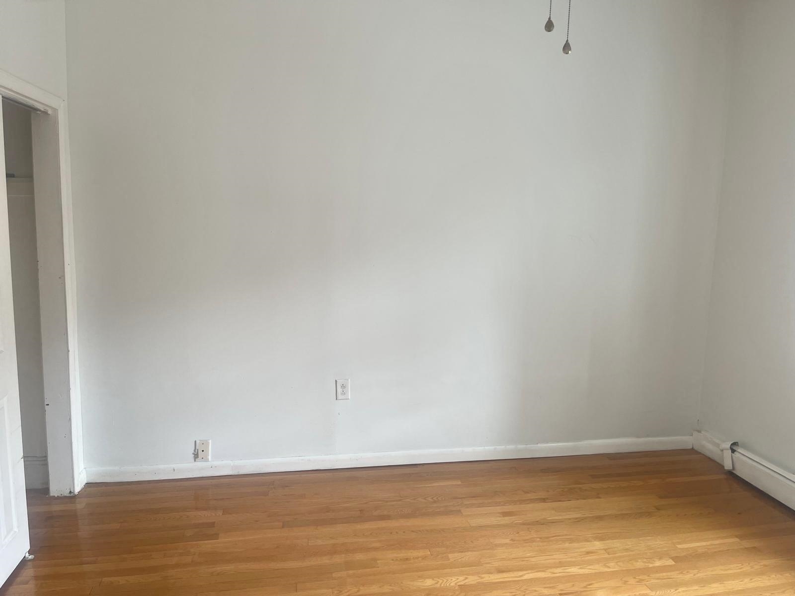 200 Hutton Street, Unit 1 Jersey City, NJ 07307 - Photo 4 of 5 a view of an empty room with wooden floor