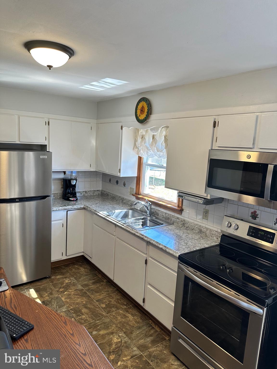 New  countertop and stainless steel appliances