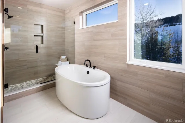 a white bath tub sitting next to a white sink