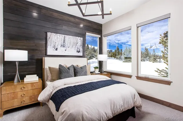 a bed room with a bed and a window