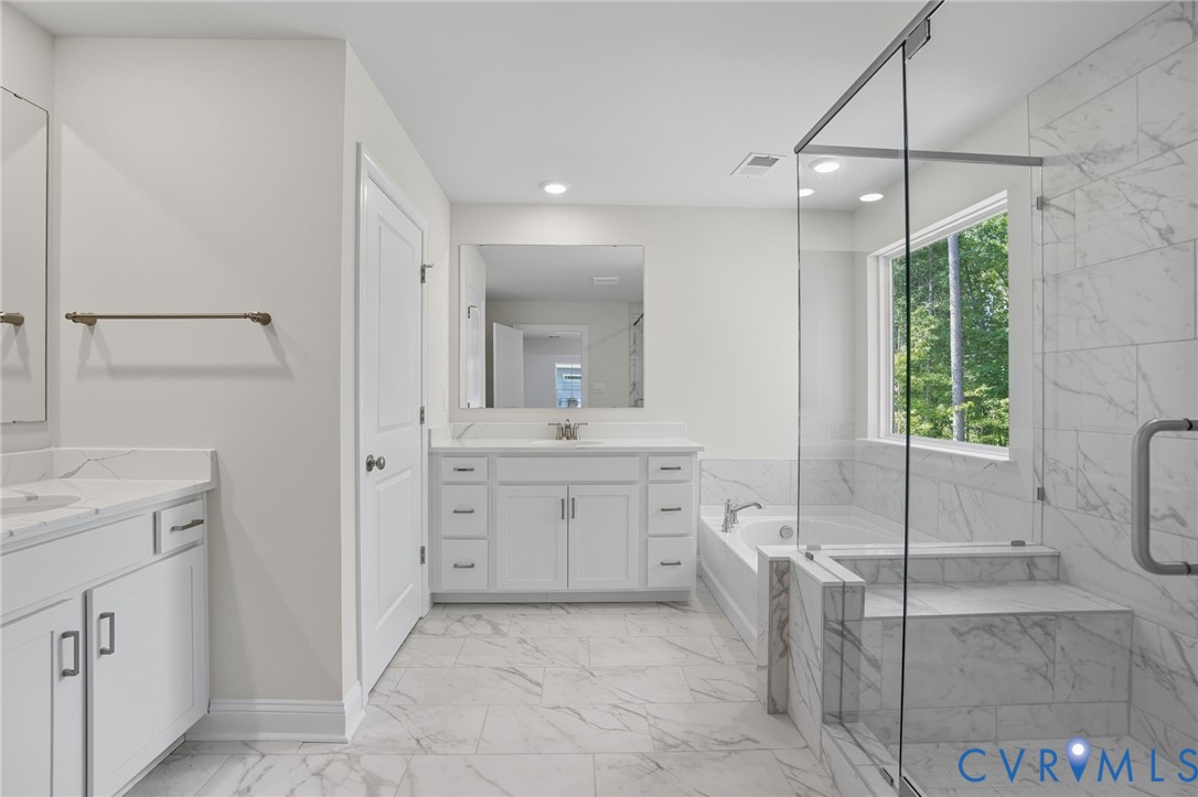 16932 Barmer Road Chesterfield, VA 23832 - Photo 30 of 33 a bathroom with a sink vanity and tub