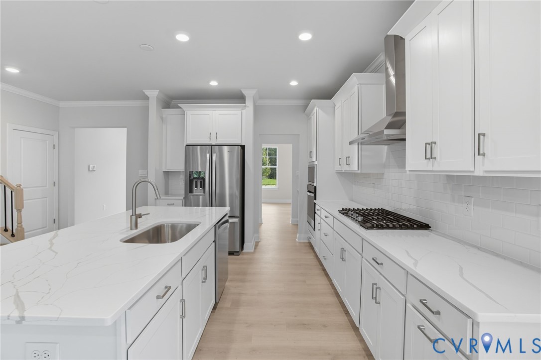 16932 Barmer Road Chesterfield, VA 23832 - Photo 5 of 33 a kitchen with kitchen island white cabinets and stainless steel appliances