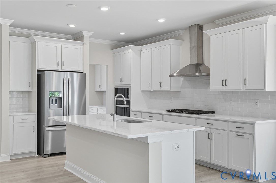 16932 Barmer Road Chesterfield, VA 23832 - Photo 8 of 33 a kitchen with stainless steel appliances granite countertop a refrigerator sink and cabinets