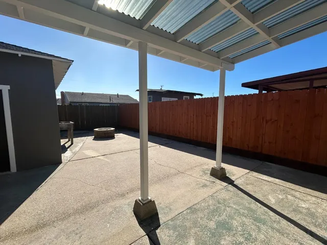 a balcony with table and chairs