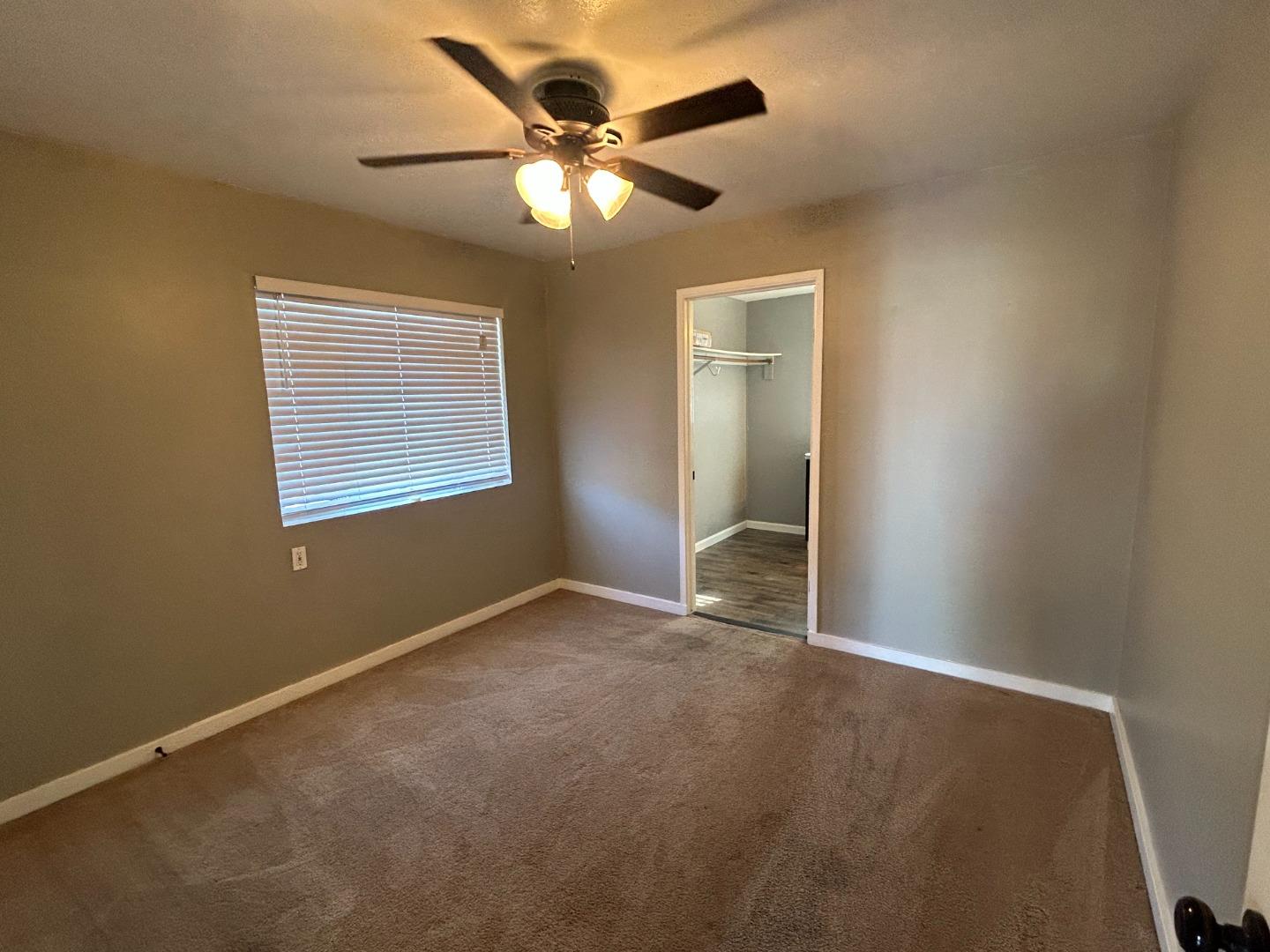 196 Surf Street Pacifica, CA 94044 - Photo 7 of 18 an empty room with closet and fan