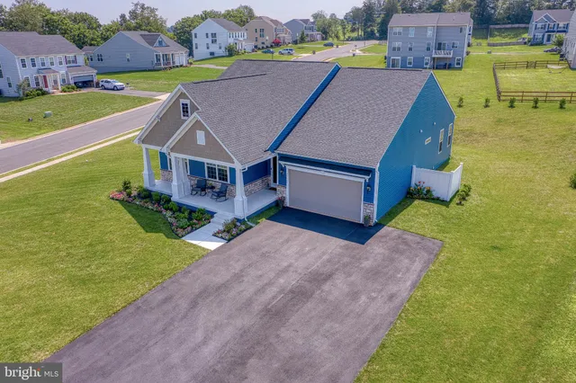 a view of a patio with table and chairs potted plants with flower plants