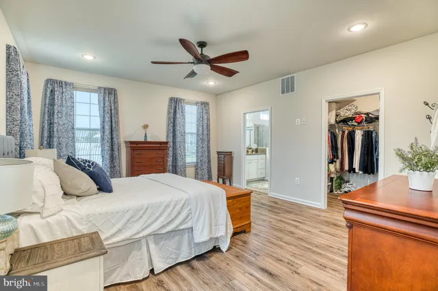 a bathroom with a double vanity sink mirror and shower