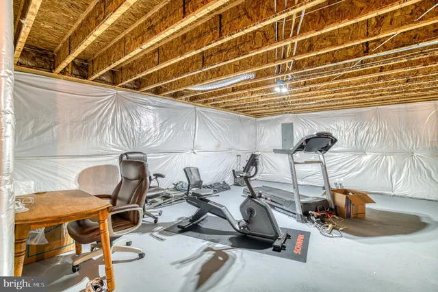 a front view of a house with a yard and ocean view