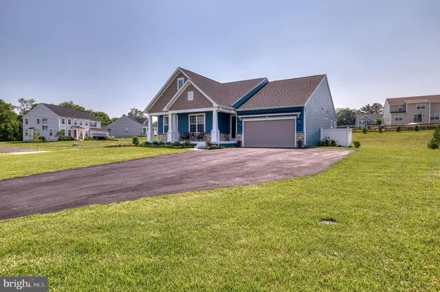 a view of a swimming pool with a table and chairs