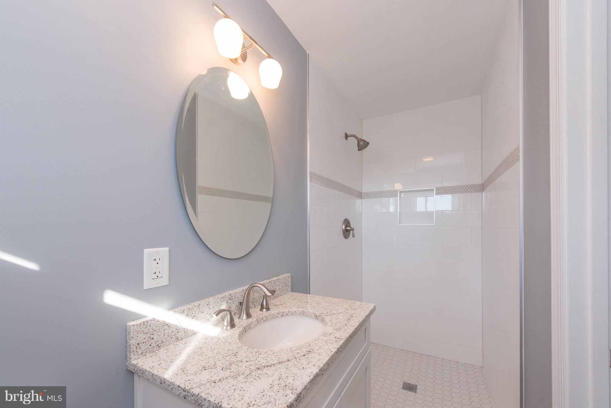 10601 Johns Hopkins Road Laurel, MD 20723 - Photo 15 of 28 Fully Renovated Master Bath Walk-in Mosaic Tile