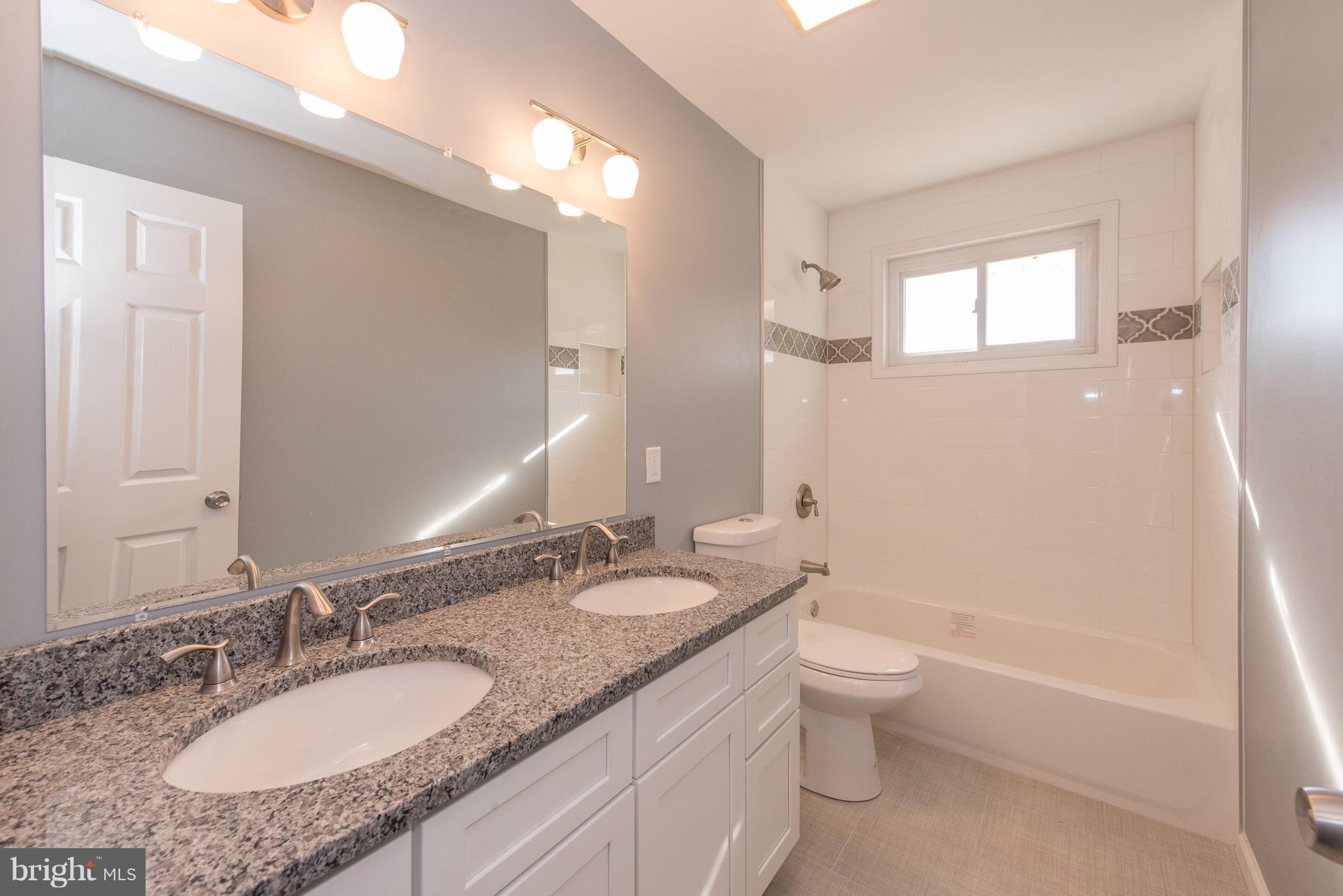 10601 Johns Hopkins Road Laurel, MD 20723 - Photo 16 of 28 Fully Renovated Hall Bath w/ Double Vanity