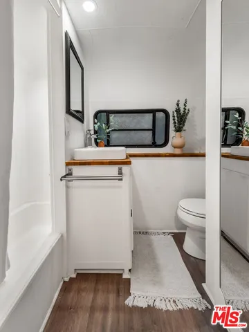 a bathroom with a toilet and a sink