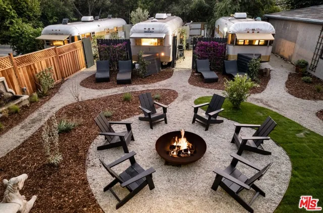 an aerial view of a house with patio outdoor seating