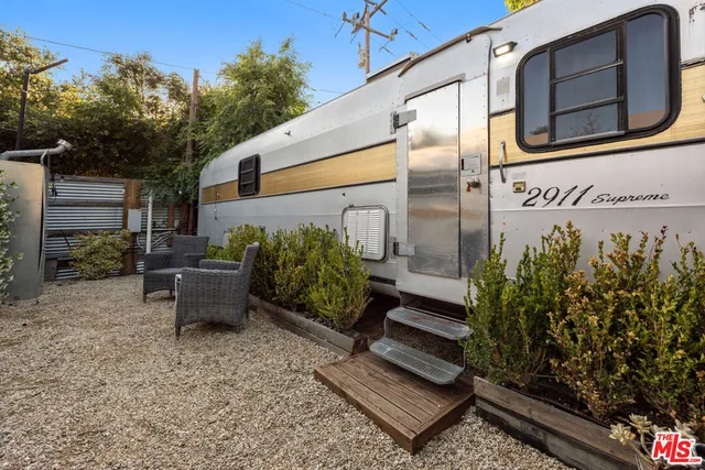 a bench sitting in front of a building