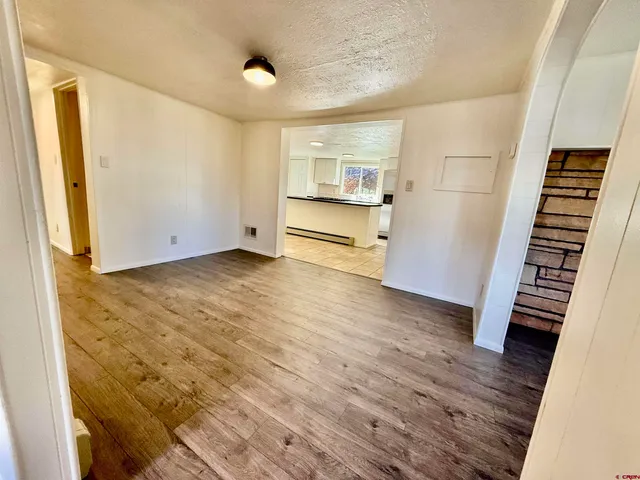 a kitchen with stainless steel appliances a refrigerator and a stove